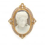 An enamel, diamond, carved agate and gold cameo brooch