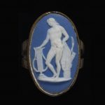 Ring of gold set with a blue jasperware plaque with a white relief of Apollo