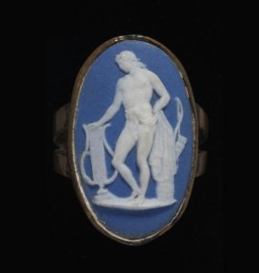 Ring of gold set with a blue jasperware plaque with a white relief of Apollo