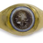 A ROMAN BANDED AGATE RINGSTONE WITH A HEAD OF BACCHUS