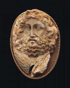 A GREEK CORAL CAMEO OF ZEUS HELLENISTIC PERIOD, CIRCA 2ND CENTURY B.C.