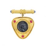 Gold, Black Onyx Cameo and Cabochon Ruby and Sapphire Brooch