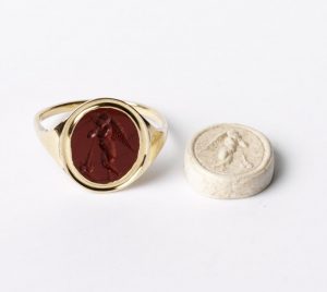Upright oval intaglio. Red jasper. Depicting the winged youth Thanatos (Death).