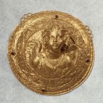 Medallion, originally part of a headdress: bust of Eros