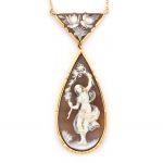 A shell cameo pendant/necklace a dancing nymph cameo suspended from a floral motif cameo