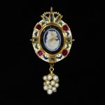 Pendant of enamelled gold set with an onyx cameo of Queen Elizabeth I and with table-cut rubies and diamonds; hung with a cluster of pearls.