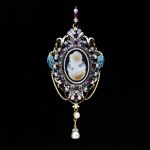 Pendant Enamelled gold, set with rubies, sapphires and pearls, and with a cameo of carved onyx