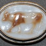 Sardonyx cameo engraved with a cow walking to the left