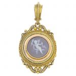 A mid Victorian gold agate cameo pendant. The sardonyx cameo carved to depict the Genius of Light