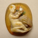 Cameo; agate; fragment of larger subject fixed to new ground of same stone, now separated; infant Christ holding apple and supported in two hands of the Virgin.